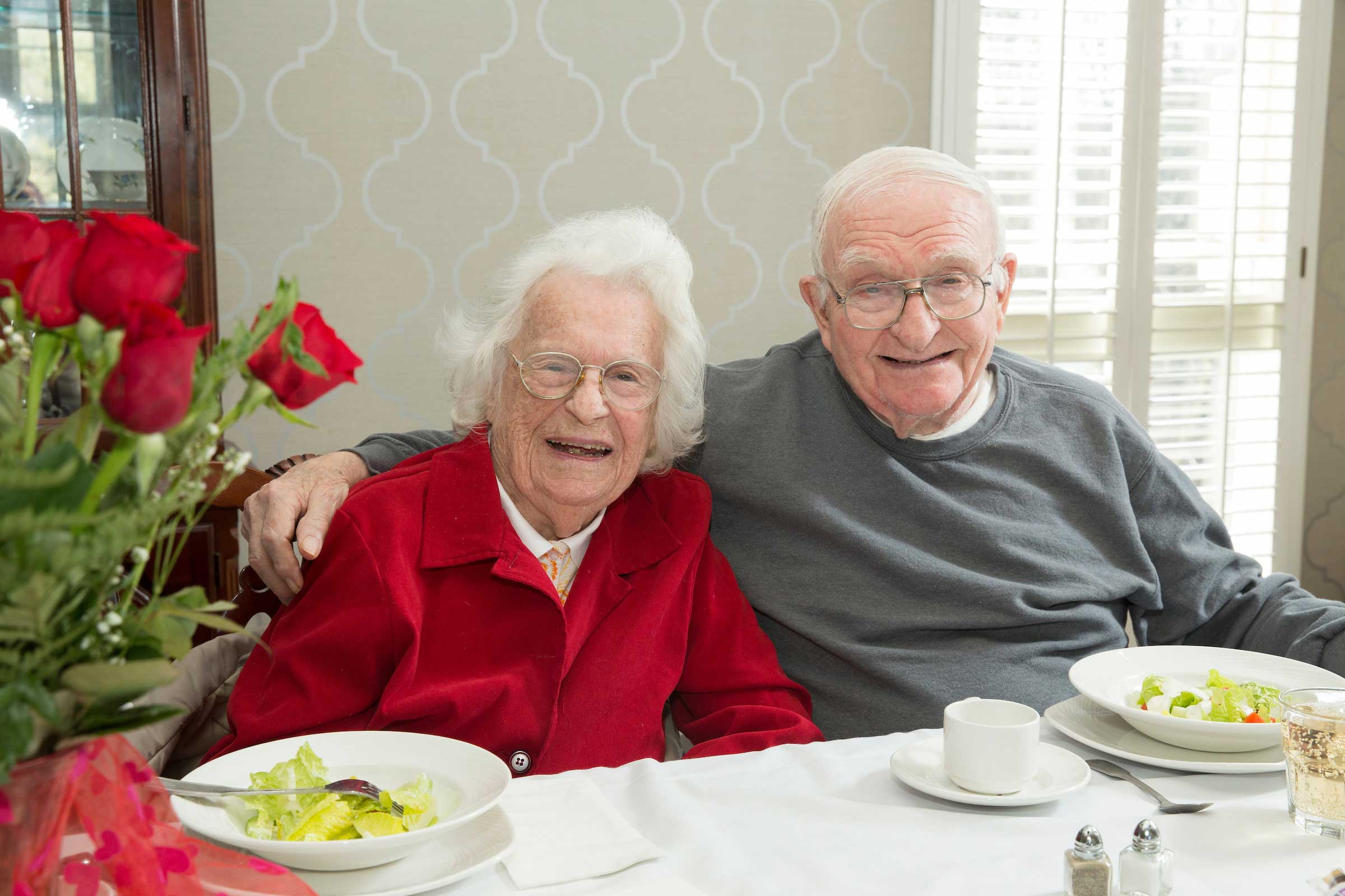 Marjorie and Wendell “Buzz” McKennerney, from left, laugh while reminiscing during the Valentine’s Day luncheon held at Mulberry Gardens of Southington.