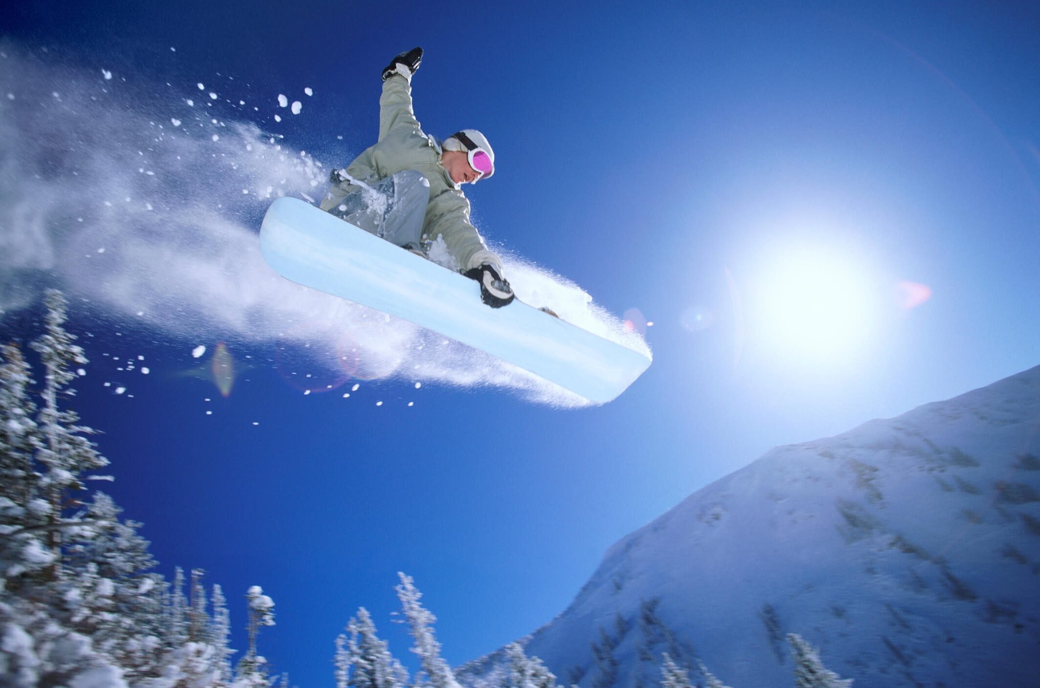 Snowboarder, midair.