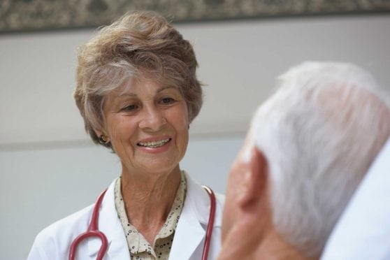 Female doctor talking to male patient.