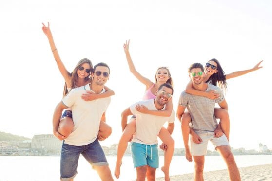 Three young couples on the beach.