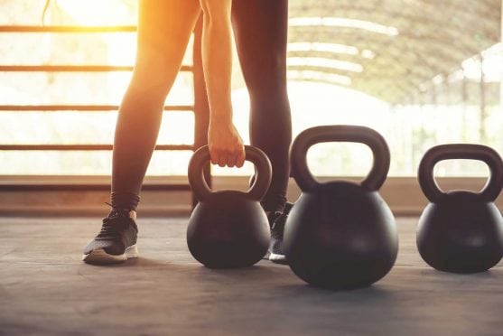 Woman with kettlebell.