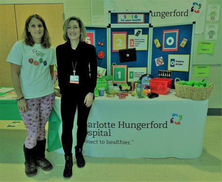 Fit Together Program Coordinator Jessica Stewart (L) and CHH Coordinator of Community Development Joyce Germano (R) promote healthy living at a kindergarten fair in Torrington.