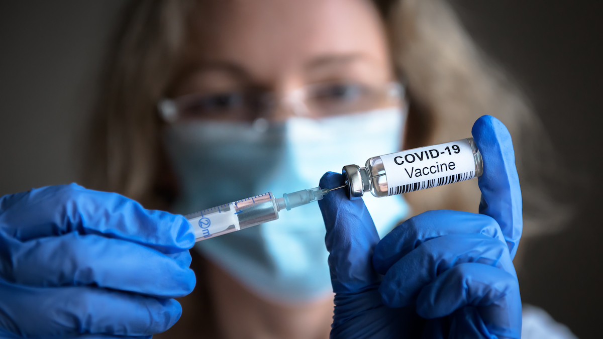 COVID vaccine and syringe
