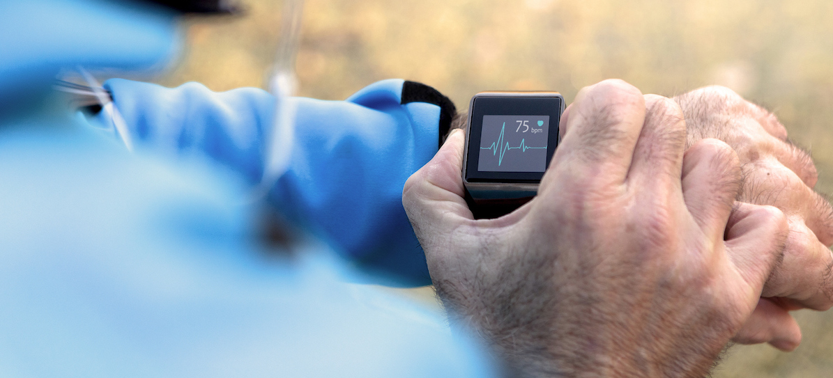 Elderly Man using Smart Watch measuring heart rate