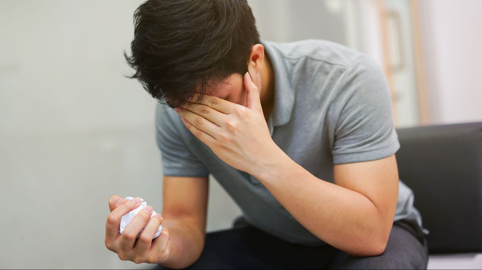 Young man suffers from brain fog.