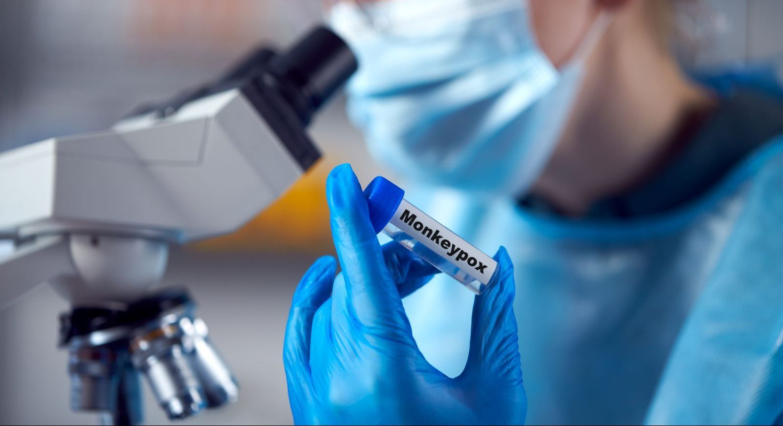 Scientist holds a vial of monkeypox vaccine.