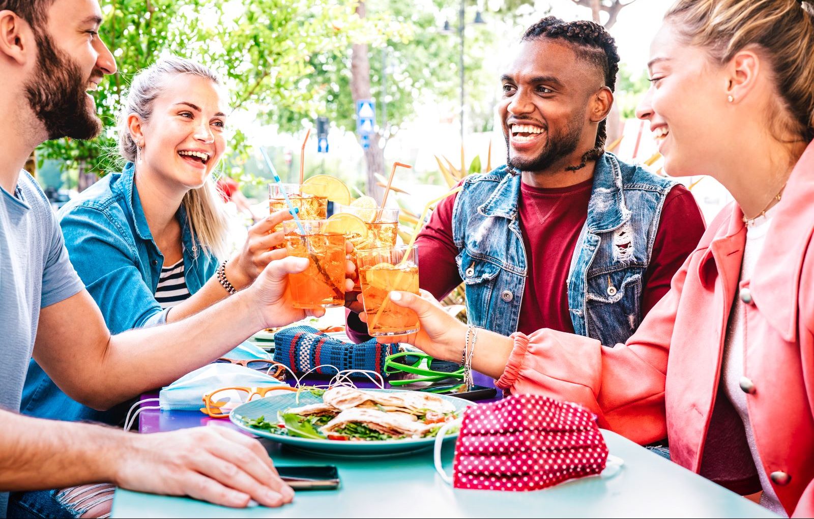 Four friends drink together.