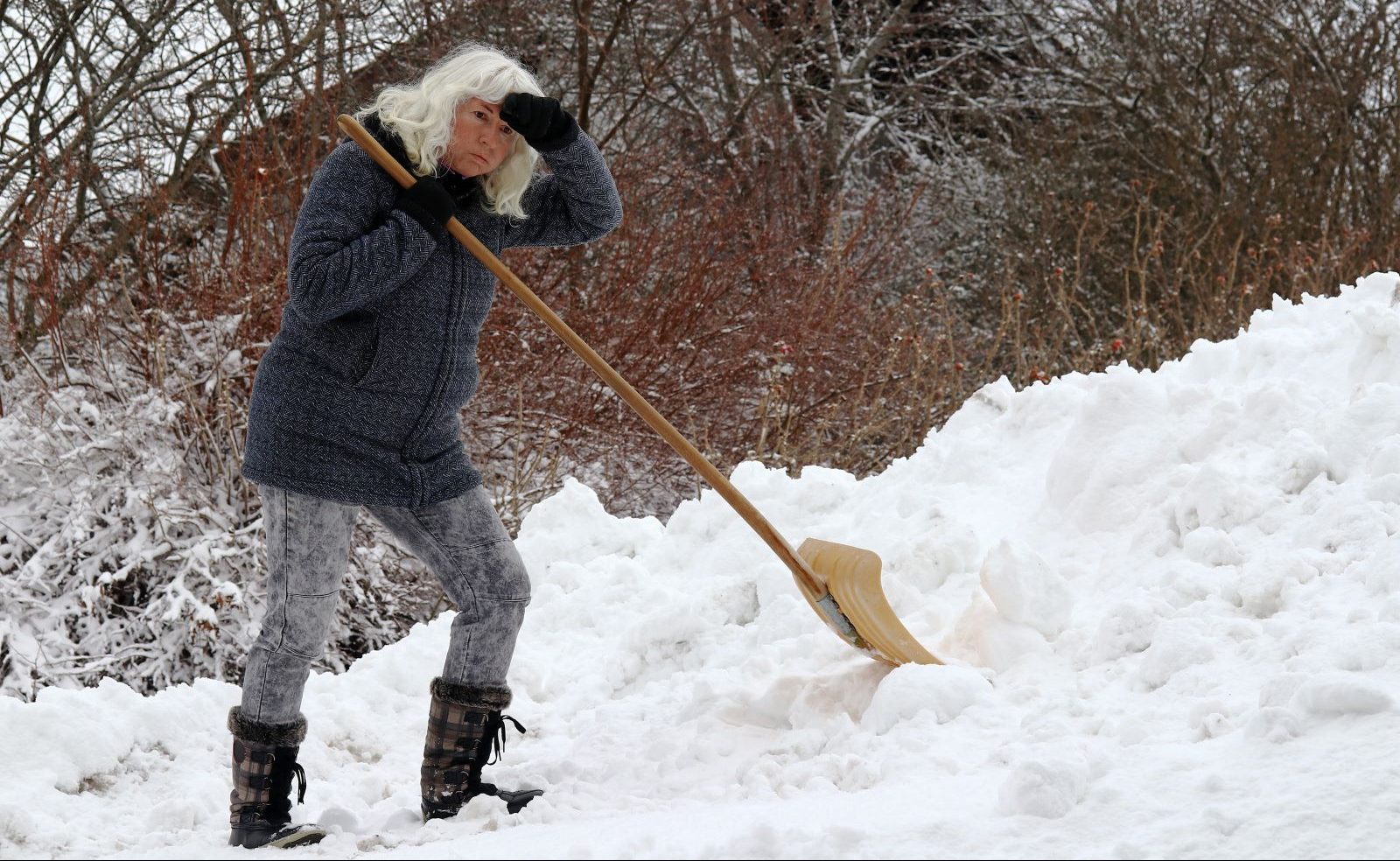 A person removes snow during the colder months.